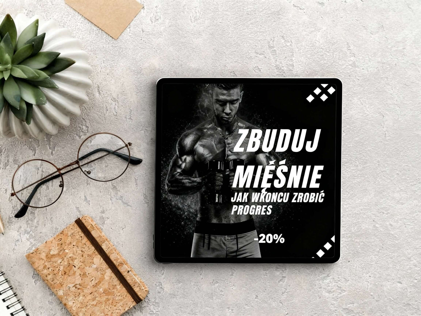 Zbuduj Mięśnie – Jak W Końcu Zrobić Progres - eBook na tle deski i rośliny